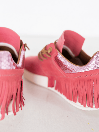 pink suede fringe sneakers