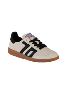 White sneaker with black accents and brown sole on a white background