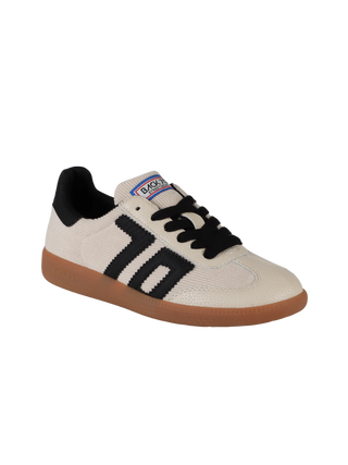 White sneaker with black accents and brown sole on a white background